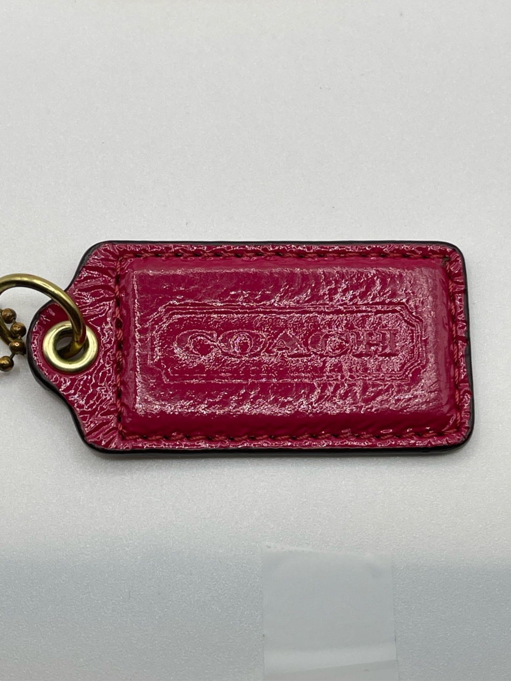 Coach Glossy Hot Pink Leather Hang Tag with Brass Chain